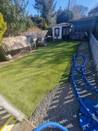 Artificial grass that has been cleaned. Looking nice in the sun.