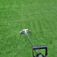 Artificial grass being cleaned